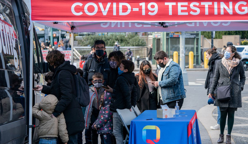 People queue at a popup COVID-19 testing site in New York